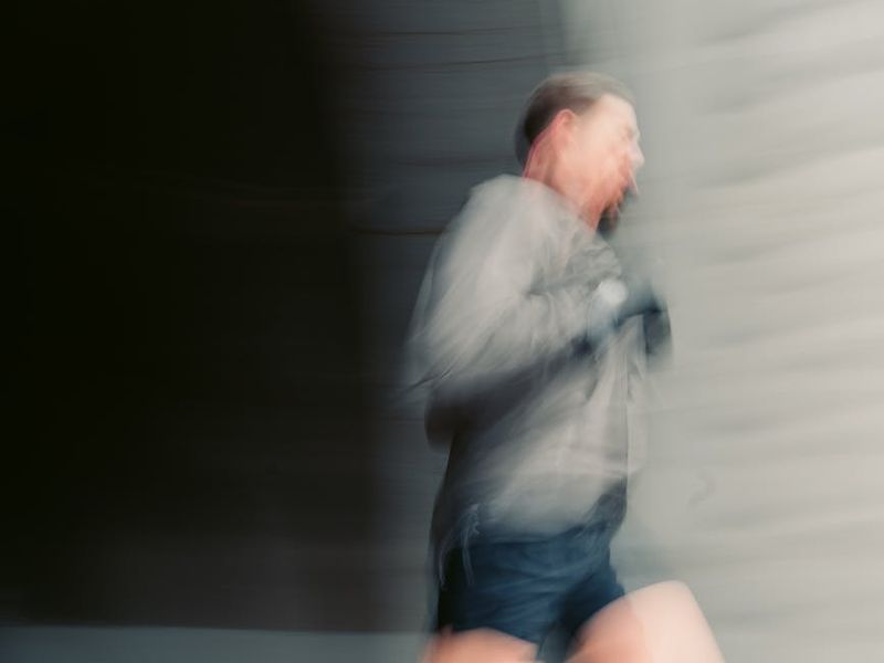 A male athlete in mid-motion, capturing the dynamic energy of a workout.